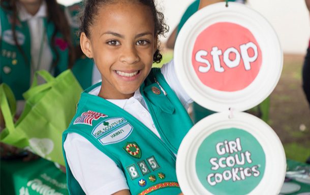 girl scout preparing for cookie sales